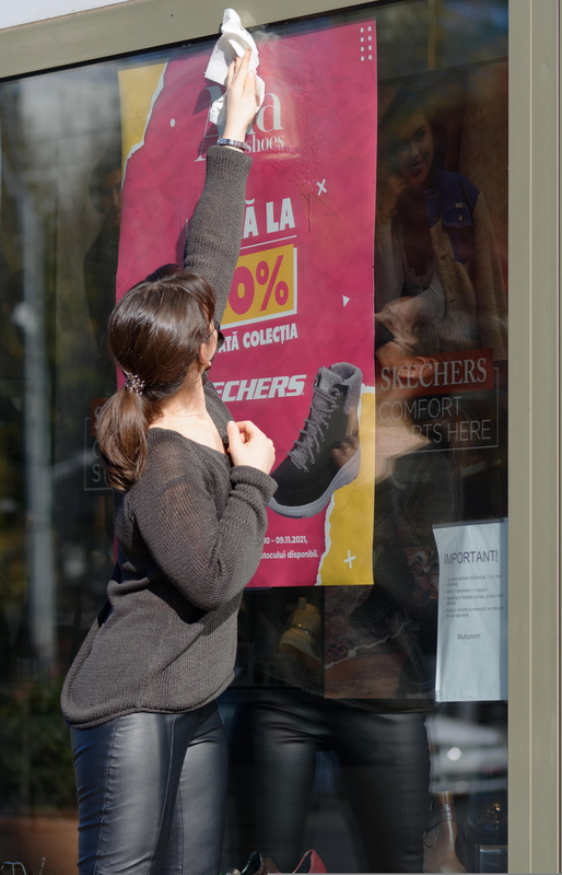 Woman cleaning a glass surface